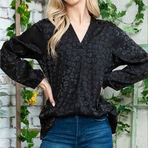 Elegant Black on black leopard print blouse.
